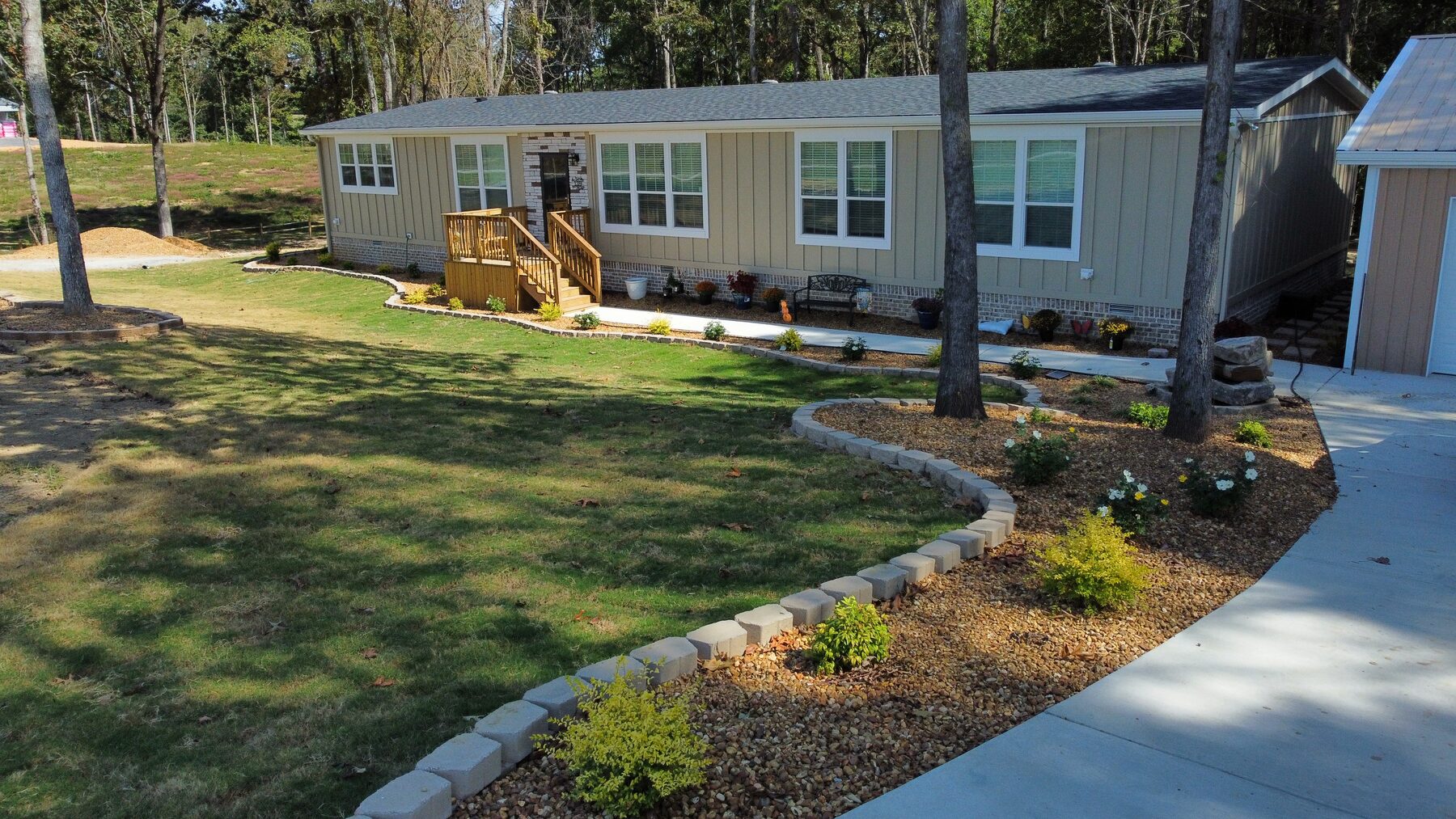 Sod, flower bed and water feature installation